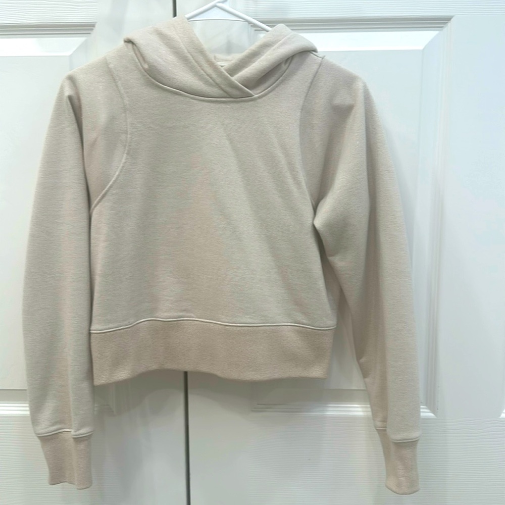 Lululemon hoodie. Size: 4. Color: cream with metallic gold threading.